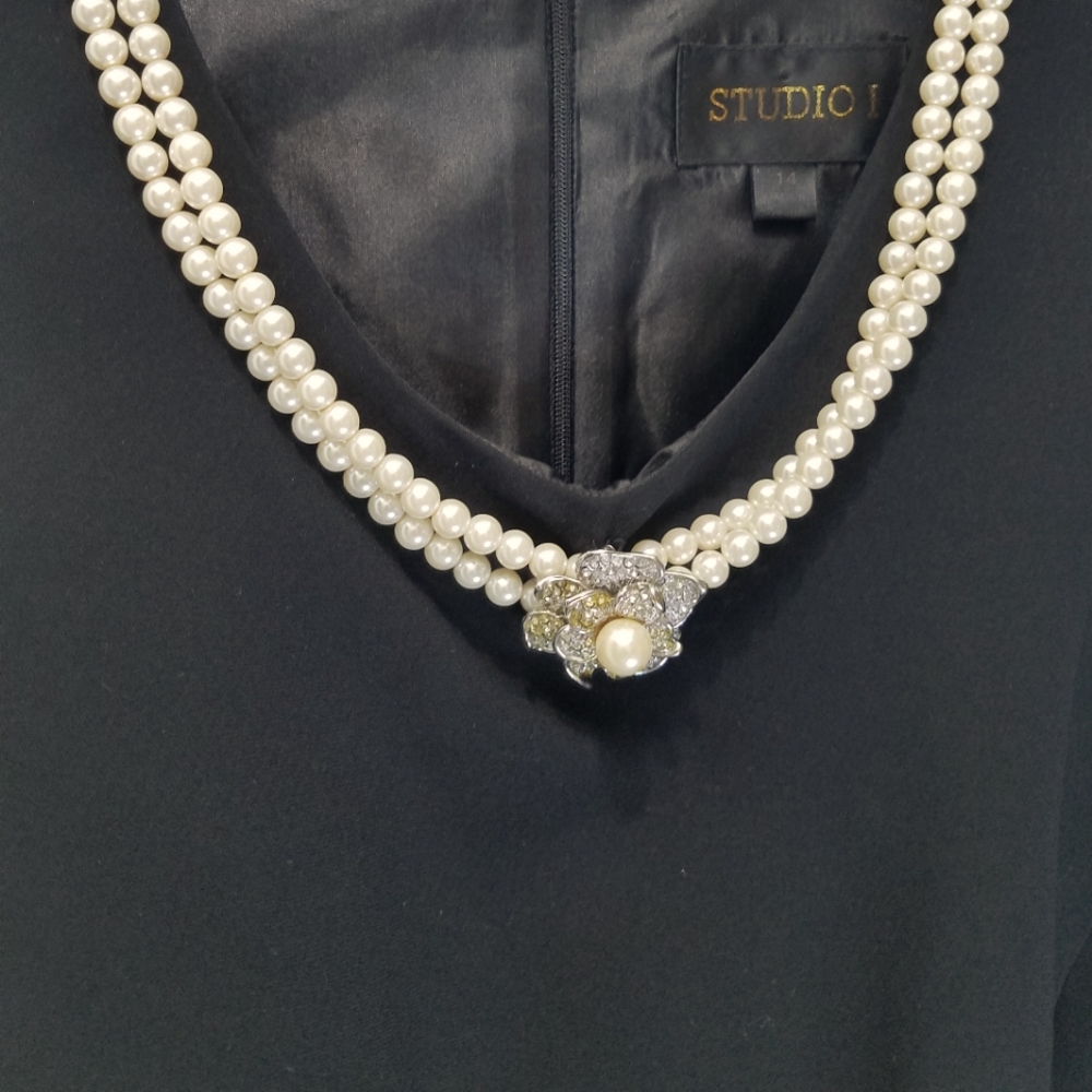 Vintage  black  pant suit.  No sleeves  pearls attached. 20 inches pit to pit